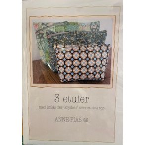 Anne-Pias 3 etuier med lynls der krydser over etuiets top